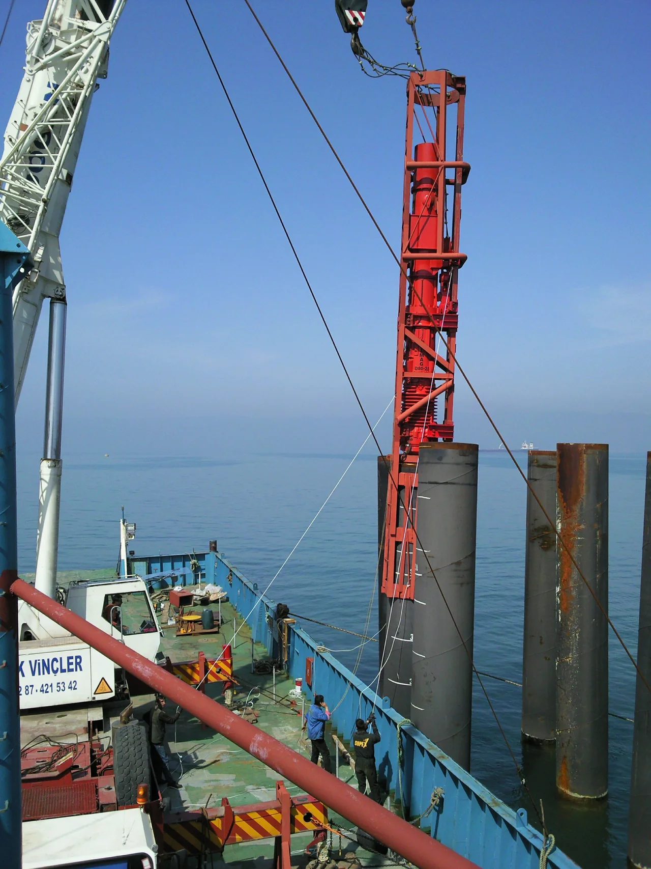 Dolphin pile installation work at sea